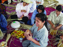 People of Thailand learn how to make vetiver handicrafts.